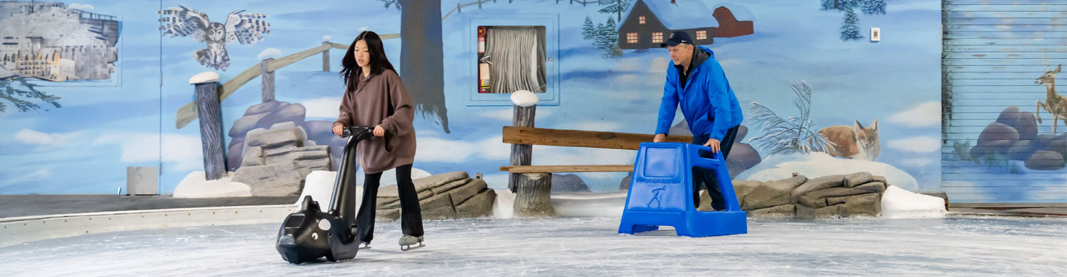 Dad and daughter using the Skate Helper Orca and the Skate Helper